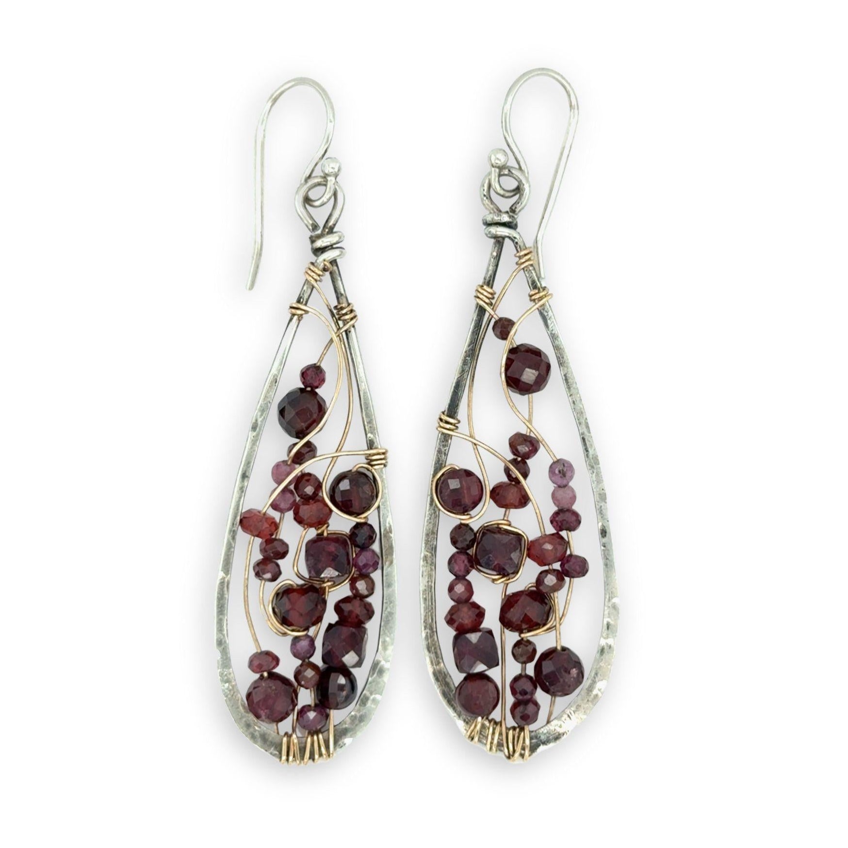 darkened sterling silver drop earrings embroidered with a variety of faceted garnet gemstones in gold filled wire