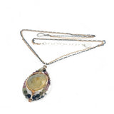 Sterling silver drop necklace with round faceted prehnite gemstone, accented with watermelon tourmaline. Oxidized sterling silver and gold-filled delicate double chain