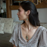 Sterling silver drop necklace with round faceted prehnite gemstone, accented with watermelon tourmaline. Oxidized sterling silver and gold-filled delicate double chain