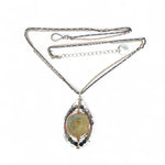 Sterling silver drop necklace with round faceted prehnite gemstone, accented with watermelon tourmaline. Oxidized sterling silver and gold-filled delicate double chain