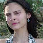 A pair of mini sparkly mint colored hexagon pcrystal earrings with handmade sterling silver tops and black tourmalinated faceted quartz gemstones, designed with built-in sterling silver hooks to wear like a post earring