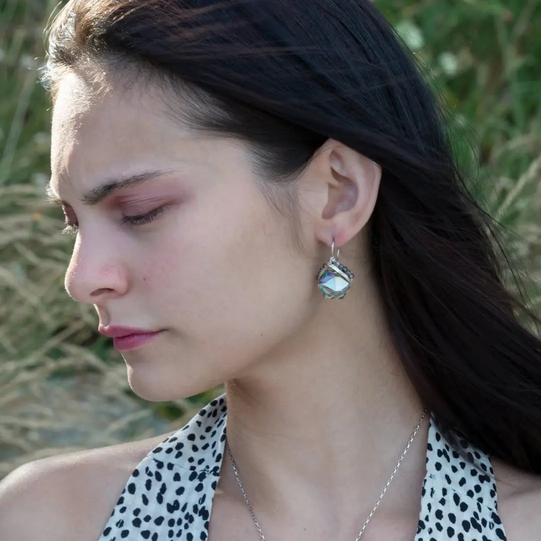 A pair of mini sparkly mint colored hexagon pcrystal earrings with handmade sterling silver tops and black tourmalinated faceted quartz gemstones, designed with built-in sterling silver hooks to wear like a post earring