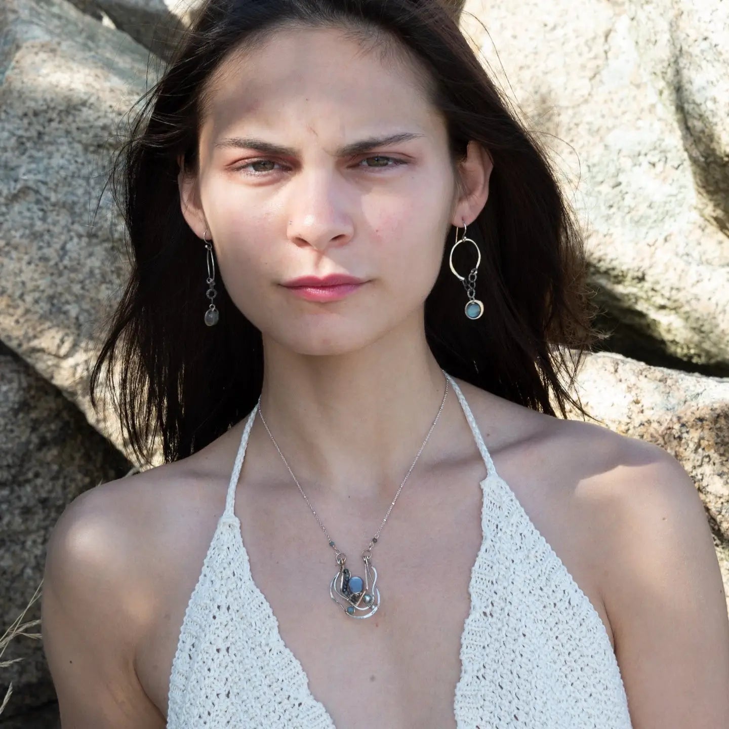 Sterling silver and bronze hammered ripples form an organic pendant filled with blue silver fresh water pearl, blue tourmaline, crystal. and mauve moonstone teardrop gemstone necklace