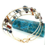 Bronze and sterling silver wide bracelet with labradorite, hessonite garnet, iolite, pyrite, and blue opal gemstones, with  twisted brass accents