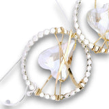 Sterling silver dot hoops with clear faceted heart shaped crystals held in wraps of hammered 14k gold filled wire
