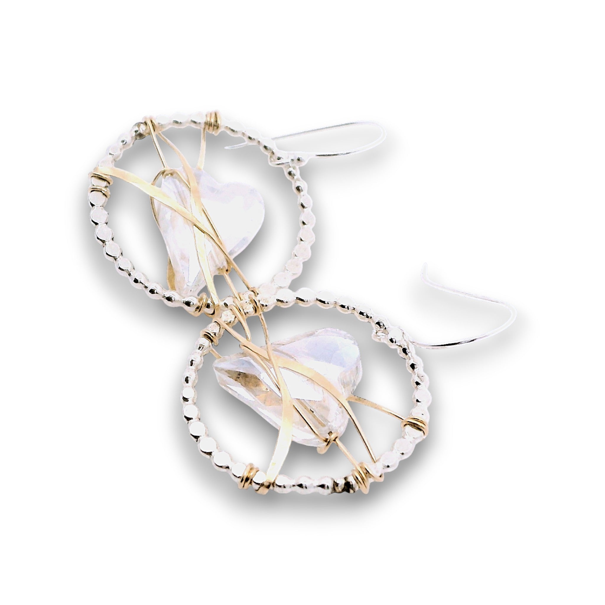 Sterling silver dot hoops with clear faceted heart shaped crystals held in wraps of hammered 14k gold filled wire