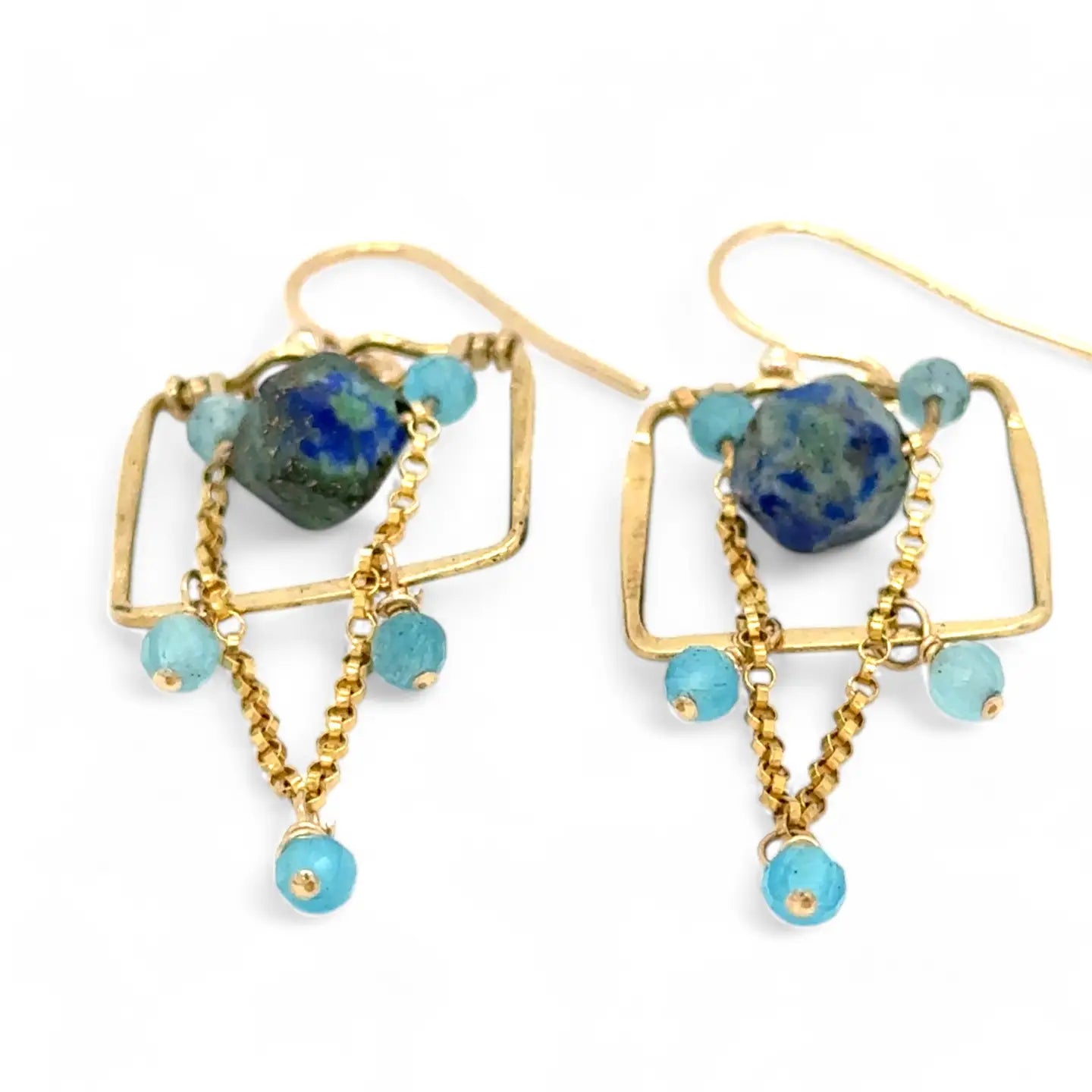 A pair of brass puzzle box earrings  featuring aqua blue cat's eye, azurite gemstones, and a gold-filled rolo chain.