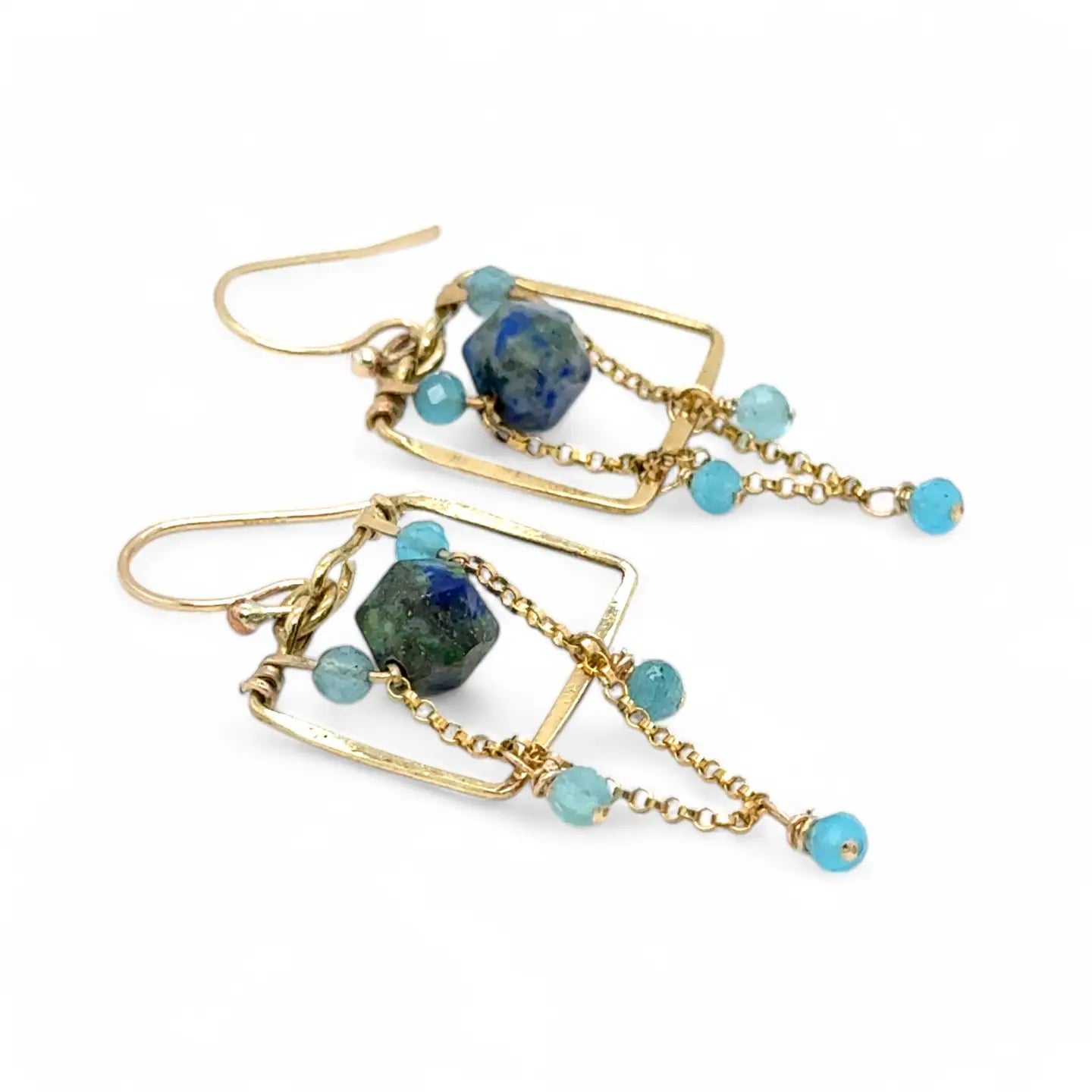 A pair of brass puzzle box earrings  featuring aqua blue cat's eye, azurite gemstones, and a gold-filled rolo chain.