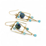 A pair of brass puzzle box earrings  featuring aqua blue cat's eye, azurite gemstones, and a gold-filled rolo chain.