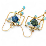 A pair of brass puzzle box earrings  featuring aqua blue cat's eye, azurite gemstones, and a gold-filled rolo chain.