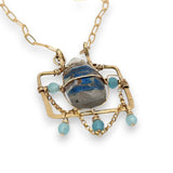 Brass puzzle box mini necklace with an azurite drop accented with blue cat's eye gemstones and delicate gold filled rolo chain