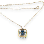Brass puzzle box mini necklace with an azurite drop accented with blue cat's eye gemstones and delicate gold filled rolo chain