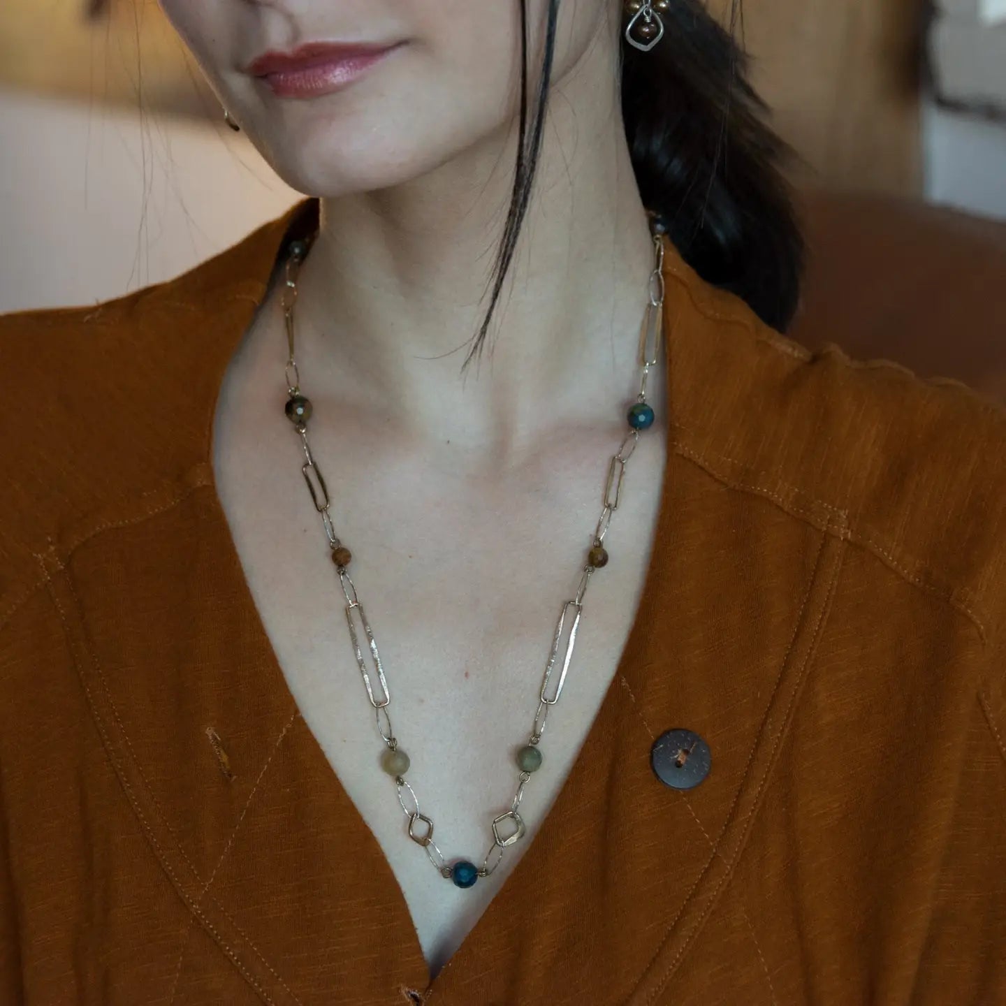 Long handmade brass link and gold filled necklace interspersed with cat's eye faceted gemstones 