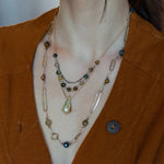 Long handmade brass link and gold filled necklace interspersed with cat's eye faceted gemstones 
