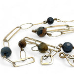 Long handmade brass link and gold filled necklace interspersed with cat's eye faceted gemstones 