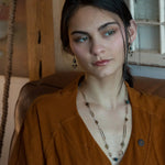 Long handmade brass link and gold filled necklace interspersed with cat's eye faceted gemstones 