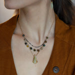 Green yellow jade long diamond hangs from gold filled box chain, with a layer of cat's eye gemstones, and a layer of oxidized sterling silver chain necklace