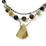 Green yellow jade long diamond hangs from gold filled box chain, with a layer of cat's eye gemstones, and a layer of oxidized sterling silver chain necklace