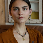 Green yellow jade long diamond hangs from gold filled box chain, with a layer of cat's eye gemstones, and a layer of oxidized sterling silver chain necklace