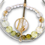 sterling silver twisted wire hoops with rutilated quartz and cubic zirconia gemstones on 14k gold filled wire and earring hooks