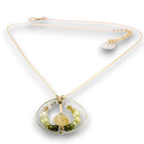 Sterling silver braided wire circle pendant filled with rutilated quartz and green cubic zirconia gemstones on gold filled wire and a 14k gold filled chain necklace