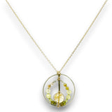 Sterling silver braided wire circle pendant filled with rutilated quartz and green cubic zirconia gemstones on gold filled wire and a 14k gold filled chain necklace