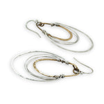 handmade bronze mini ovals with hammered sterling silver larger oval and fine sterling silver webbing in between 