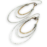 handmade bronze mini ovals with hammered sterling silver larger oval and fine sterling silver webbing in between 