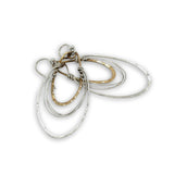 handmade bronze mini ovals with hammered sterling silver larger oval and fine sterling silver webbing in between 