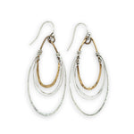 handmade bronze mini ovals with hammered sterling silver larger oval and fine sterling silver webbing in between 