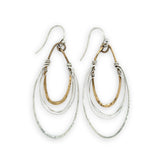 handmade bronze mini ovals with hammered sterling silver larger oval and fine sterling silver webbing in between 