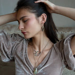 Two prehnite faceted gemstone drops are held within layers of mixed tourmaline, sterling silver, and bronze hammered metal to form our rainbows of tourmaline necklace