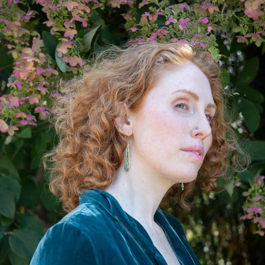 Turquoise and hemimorphite gemstones wrapped in sterling silver attached to a skinny bronze drop earring