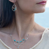 A handmade hammered sterling silver link double chain necklace with gold filled delicate chain, turquoise, blue quartz, and opal gemstones