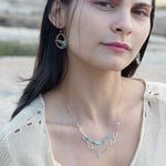 A handmade hammered sterling silver link double chain necklace with gold filled delicate chain, turquoise, blue quartz, and opal gemstones