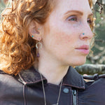 raw ruby nugget gemstones on sterling silver chain hanging from sterling silver horseshoe shaped earrings