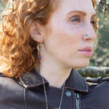 raw ruby nugget gemstones on sterling silver chain hanging from sterling silver horseshoe shaped earrings