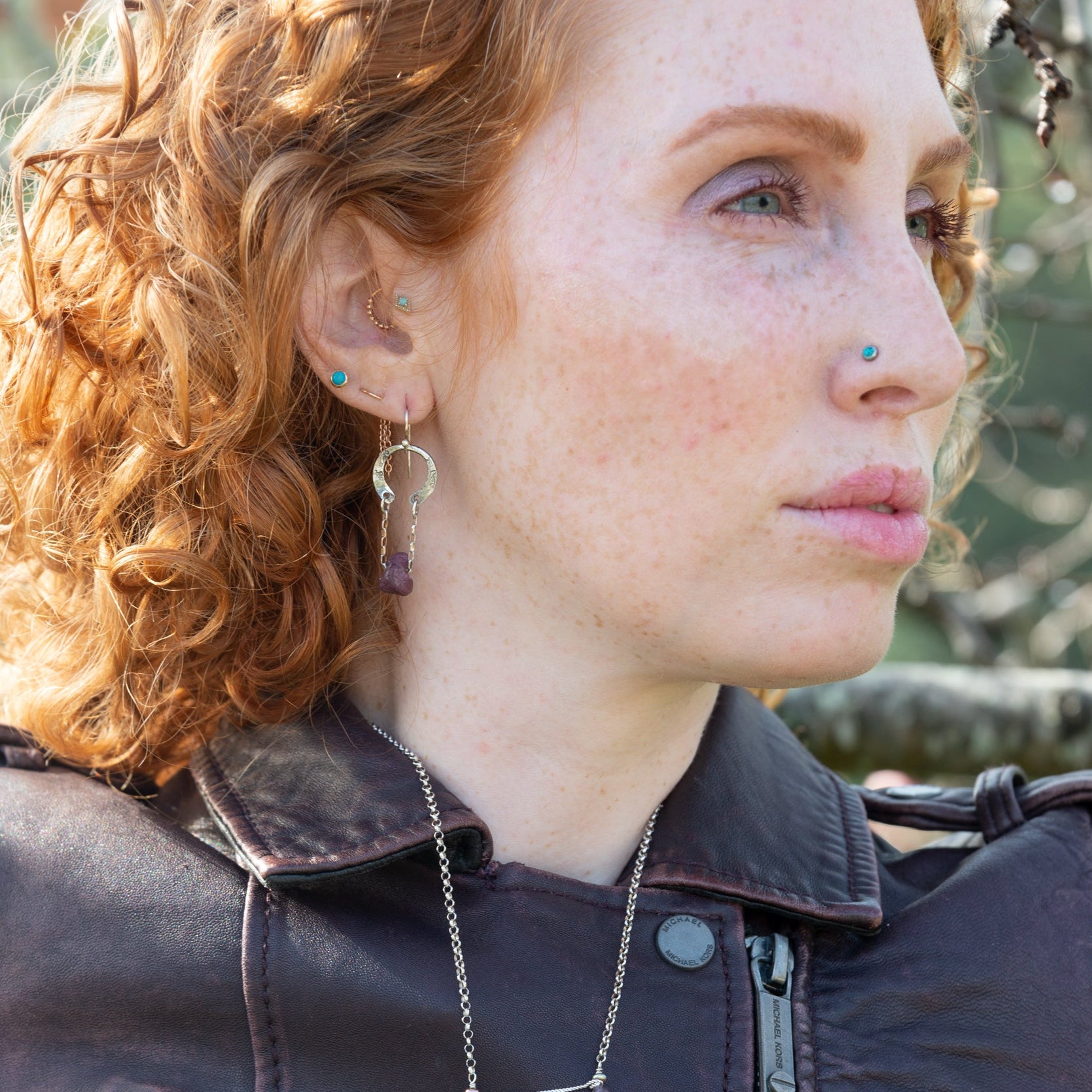 raw ruby nugget gemstones on sterling silver chain hanging from sterling silver horseshoe shaped earrings