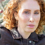 raw ruby nugget gemstones on sterling silver chain hanging from sterling silver horseshoe shaped earrings