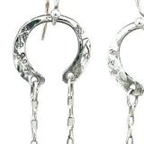 raw ruby nugget gemstones on sterling silver chain hanging from sterling silver horseshoe shaped earrings