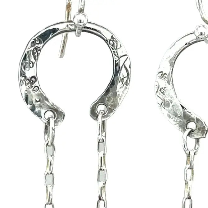 raw ruby nugget gemstones on sterling silver chain hanging from sterling silver horseshoe shaped earrings