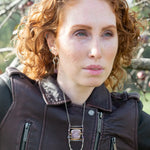 raw ruby nugget gemstones on sterling silver chain hanging from sterling silver horseshoe shaped earrings