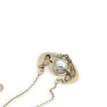 Brass textured pendant with fresh water pearl center, accented with rutilated quartz gemstones on gold filled delicate chain necklace