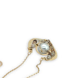 Brass textured pendant with fresh water pearl center, accented with rutilated quartz gemstones on gold filled delicate chain necklace