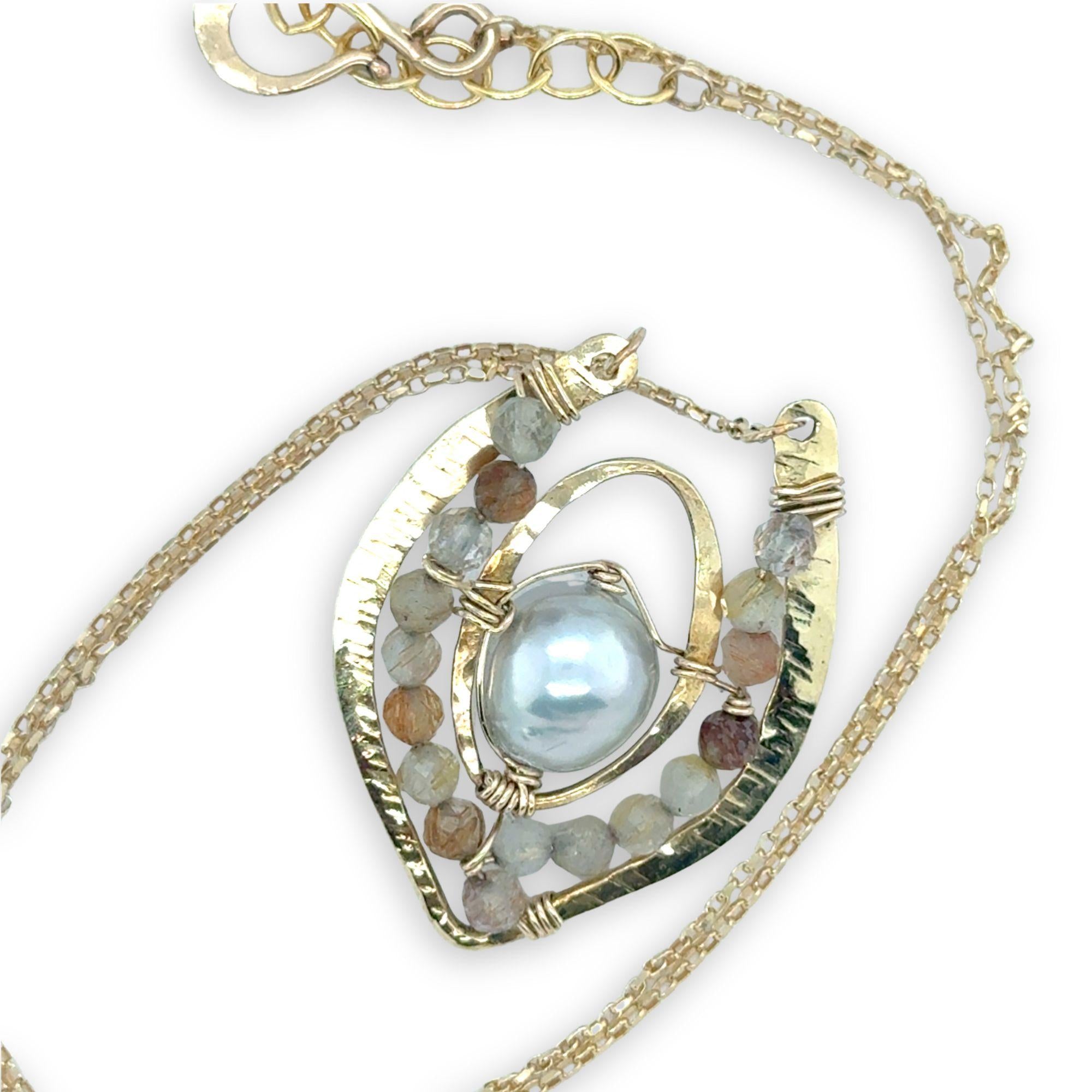Brass textured pendant with fresh water pearl center, accented with rutilated quartz gemstones on gold filled delicate chain necklace