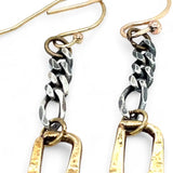 A pair of earrings featuring shiny brass rectangles attached to oxidized sterling silver chains, with gold filled French hooks.