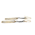 A pair of earrings featuring shiny brass rectangles attached to oxidized sterling silver chains, with gold filled French hooks.