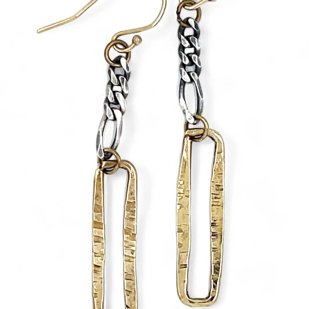 A pair of earrings featuring shiny brass rectangles attached to oxidized sterling silver chains, with gold filled French hooks.