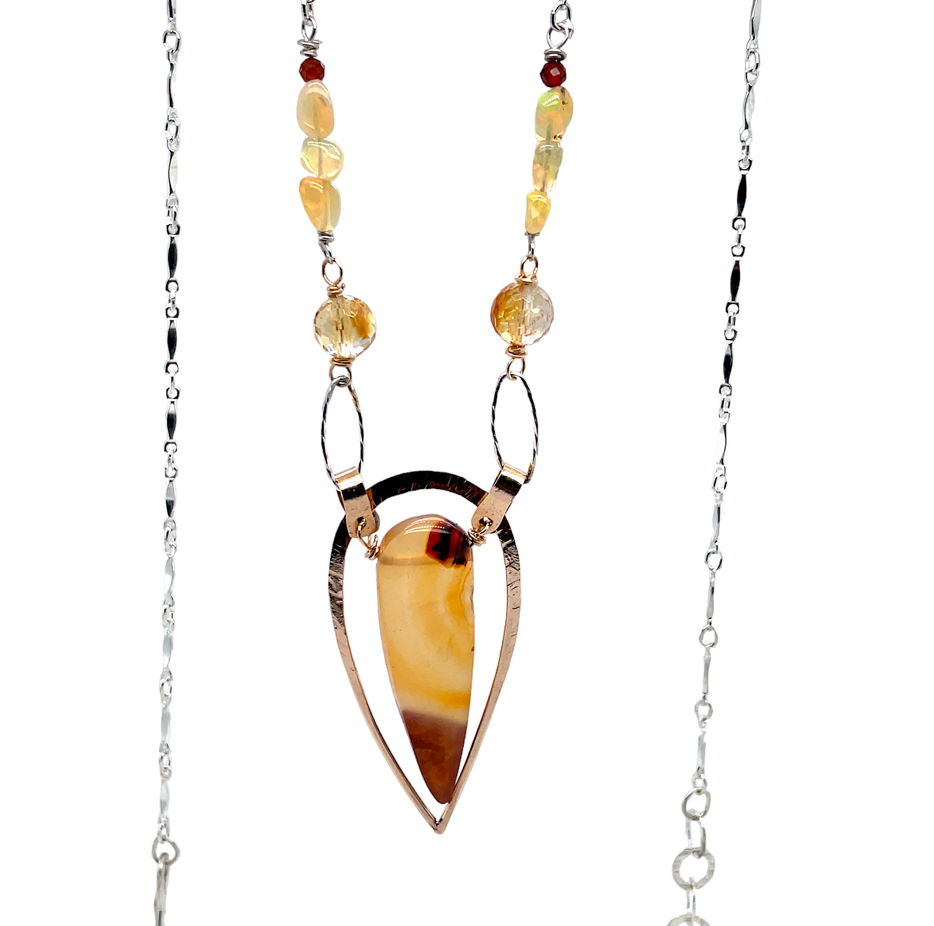 hammered brass teardrop pendant with carnelian teardrop gemstones on a chain made up of citrine, opal, and garnet gemstones on flat bar sterling silver chain necklace