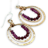 Stamped double bronze mini hoop earrings lined with two types of garnet faceted gemstones on sterling silver earring hooks